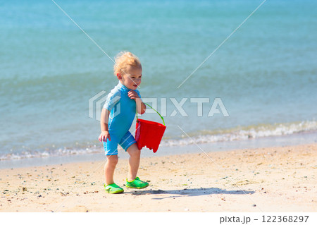 Kids playing on beach. Children play at sea. 122368297