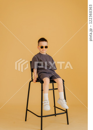 Full length image of boy child posing on yellow background 122368363