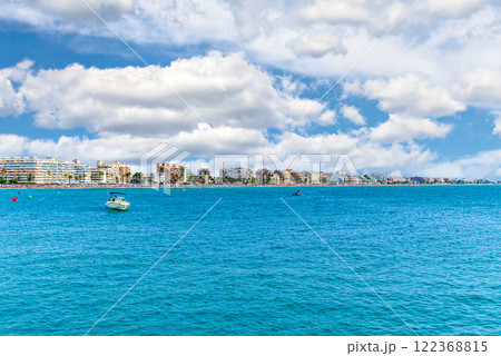 Views of Peniscola beach from its famous castle on a sunny day with white clouds. Castellon, Valencian Community, Spain Views of Peniscola beach from its famous castle on a sunny day with white clouds. Castellon, Valencian Community, Spain 122368815