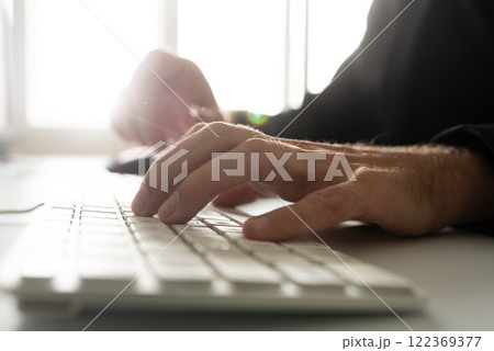 Closeup view of computer programmer working 122369377
