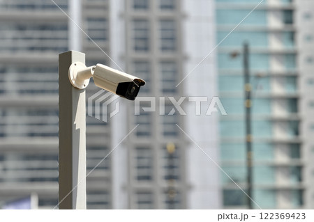 Camera security system have waterproof cover to protect camera installed on an iron pole with home security system concept in blue sky background 122369423