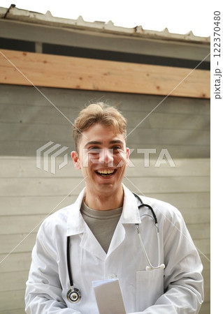 Enthusiastic Doctor Prepares To Give Good News To Patient In The Park Enthusiastic Doctor Prepares To Give Good News To Patient In The Park 122370480