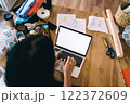 Crop woman typing on netbook in workspace 122372609