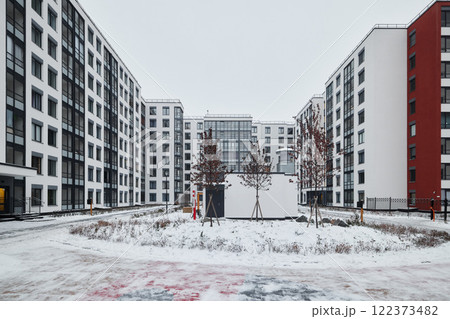 A Contemporary Modern Apartment Complex Nestled Among a Stunning Winter Landscape Environment A Contemporary Modern Apartment Complex Nestled Among a Stunning Winter Landscape Environment 122373482