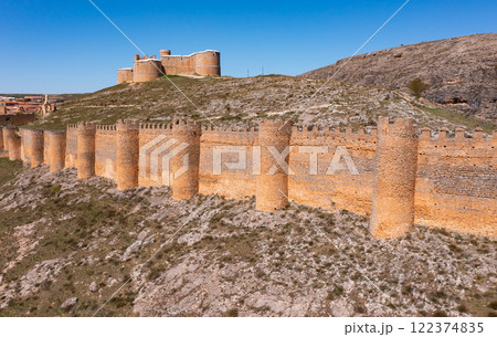Berlanga de Duero medieval castle ruin near Soria, in the Castilla Leon region Spain with blue sky from air 122374835