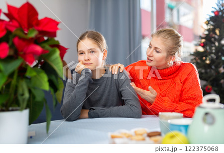 Mom soothes her teen daughter after a fight during Christmas holidays Mom soothes her teen daughter after a fight during Christmas holidays 122375068