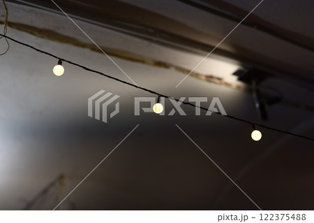 Charming String Lights Beautifully Illuminating a Cozy and Inviting Space at Night 122375488