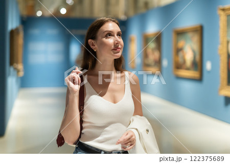 Girl view pictures and icons in museum hall Girl view pictures and icons in museum hall 122375689