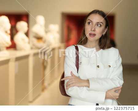 Girl view sculpture in museum hall Girl view sculpture in museum hall 122375715