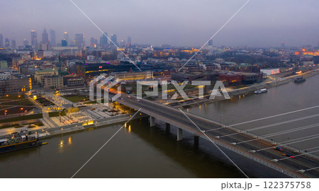Warsaw on Vistula river with Swietokrzyski Bridge in evening 122375758