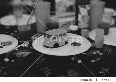 A Vibrant Arts and Crafts Table Featuring a Fun Van Model for Creative Activities and Play A Vibrant Arts and Crafts Table Featuring a Fun Van Model for Creative Activities and Play 122376411