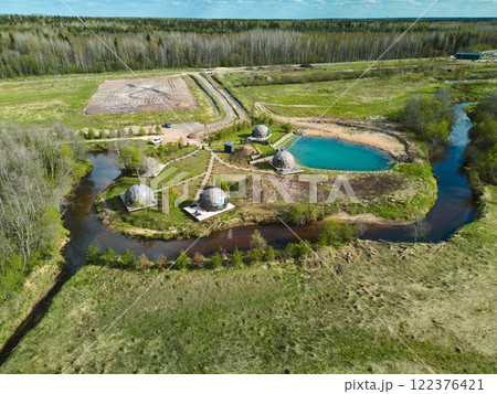 An Aerial View of EcoFriendly and Sustainable Structures Situated Near a Beautiful Waterbody An Aerial View of EcoFriendly and Sustainable Structures Situated Near a Beautiful Waterbody 122376421