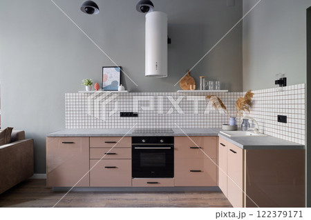 A Modern Kitchen featuring a Minimalist Design paired with Sophisticated and Stylish Accents 122379171