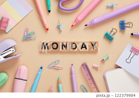 Word Monday made of wooden blocks with colorful pastel stationery on a beige background Word Monday made of wooden blocks with colorful pastel stationery on a beige background 122379984