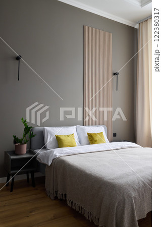 A Modern Minimalist Bedroom featuring Natural Elements and Soft Textures for comfort and style A Modern Minimalist Bedroom featuring Natural Elements and Soft Textures for comfort and style 122380317
