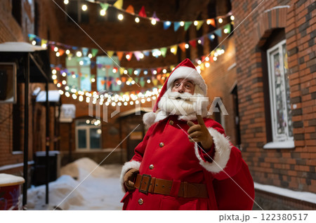 Portrait of Santa Claus in the dark with lights. Portrait of Santa Claus in the dark with lights. 122380517