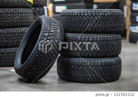 New car studded tires in the store. New car studded tires in the store. 122381122
