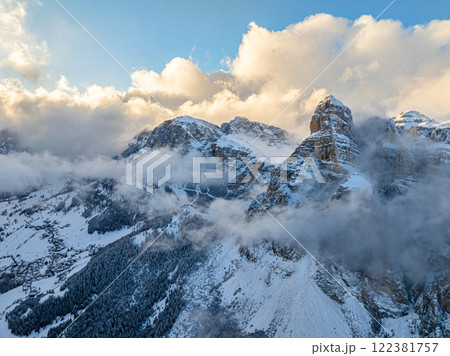 Aerial drone view of snow on the mountains in the Dolomites 122381757