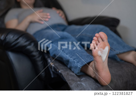 Pregnant woman on a hardware pedicure procedure in a beauty salon. Pregnant woman on a hardware pedicure procedure in a beauty salon. 122381827