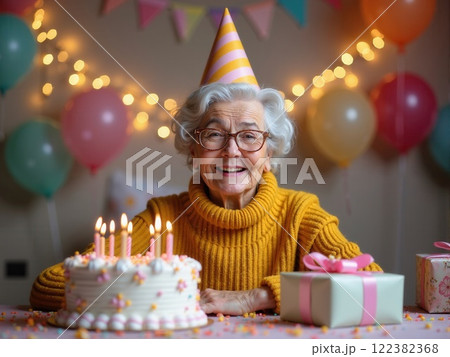 Celebrating a joyful birthday with cake and gifts in a festive setting filled with balloons and decorations 122382368