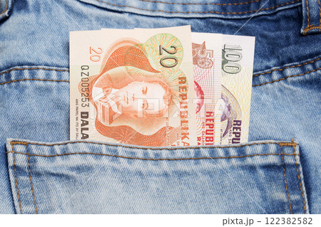 Philippine peso in the pocket of blue jeans Philippine peso in the pocket of blue jeans 122382582