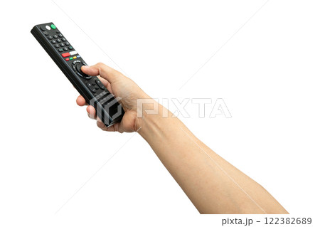 Asian woman use finger of left hand to press button on television remote control isolated on white background with clipping path. Asian woman use finger of left hand to press button on television remote control isolated on white background with clipping path. 122382689