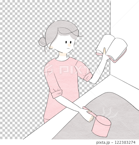 A woman cooking while looking at a recipe 122383274