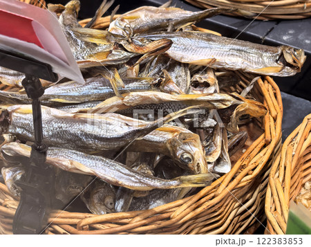 Dried fish displayed in a vibrant market during the afternoon sunlight Dried fish displayed in a vibrant market during the afternoon sunlight 122383853