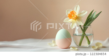 Pastel Easter still life with a tulip and a decorated egg in a vase Pastel Easter still life with a tulip and a decorated egg in a vase 122384654