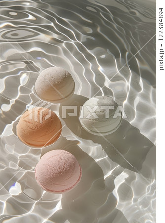 Bath bomb dissolving in clear water 122384894