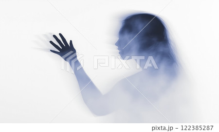 Woman showing hand while emerging from smoke cloud, exploring themes of mystery and emotion 122385287