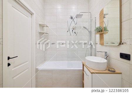 Explore the elegance of a modern bathroom design that includes both a shower and a bathtub Explore the elegance of a modern bathroom design that includes both a shower and a bathtub 122386105