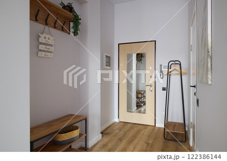 An Elegantly Modern and Stylish Home Entrance Featuring Beautiful Natural Accents 122386144