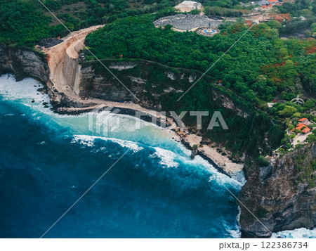 Engineering construction on cliff under Uluwatu temple in Bali. Drone view Engineering construction on cliff under Uluwatu temple in Bali. Drone view 122386734