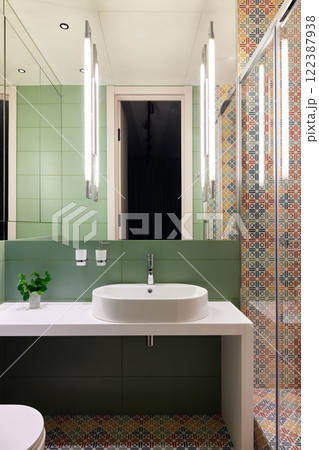 Contemporary Bathroom Featuring Striking Green Tiles and an Exquisite Decorative Shower Area 122387938