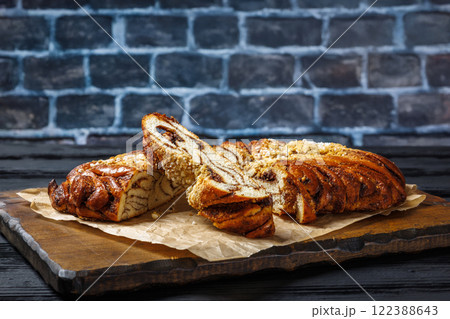 Cinnamon braided bread topped with pearl sugar Cinnamon braided bread topped with pearl sugar 122388643