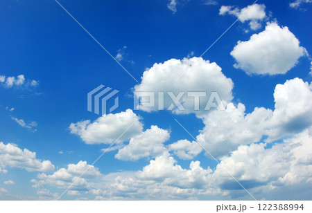 Blue sky background with tiny clouds Blue sky background with tiny clouds 122388994