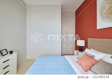 A Modern Cozy Bedroom featuring Stylish Decor, Soft Lighting, and a Relaxing Atmosphere A Modern Cozy Bedroom featuring Stylish Decor, Soft Lighting, and a Relaxing Atmosphere 122389158