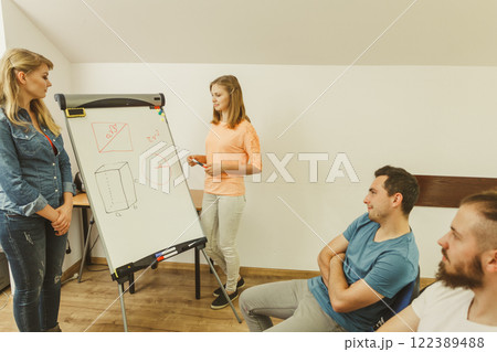 Teacher teaching mathematics to college students 122389488