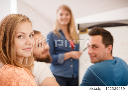 Students and teacher in classroom 122389489