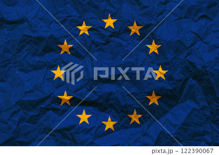 EU flag on paper. The flag of the European Union painted on crumpled craft paper. 122390067