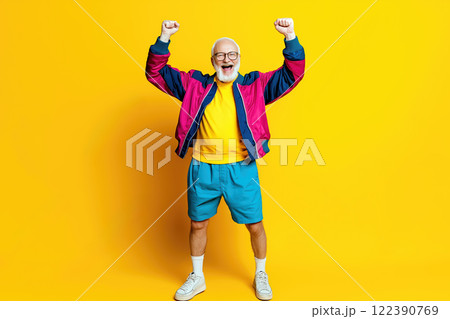 Excited senior man in fashionable clothing celebrating success with hands up. AI-generated item Excited senior man in fashionable clothing celebrating success with hands up. AI-generated item 122390769