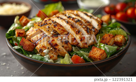 Caesar Salad with Crispy Romaine, Grilled Chicken, Parmesan, Homemade Croutons, and Yogurt-Based Dressing 122391321