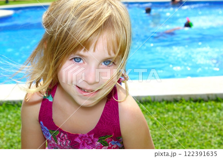 blond little girl pool garden vacation smiling portrait 122391635