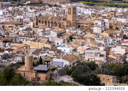 Townscape of Felanitx, Mallorca, Balearic Islands, Spain, Europe, with view to St Michael's church (Sant Miguel) and a restored old windmill tower 122394028