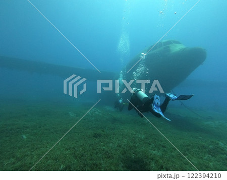 An Adventurous Diver Encounters a Massive Whale Underneath the Deep Sea, Exploring Nature An Adventurous Diver Encounters a Massive Whale Underneath the Deep Sea, Exploring Nature 122394210