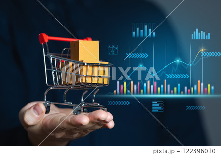 Businessman holding shopping cart with boxes and sales charts. Retail concept and sales statistics. Performance analysis, market trends. Consumer experiences and enhance business efficiency. 122396010