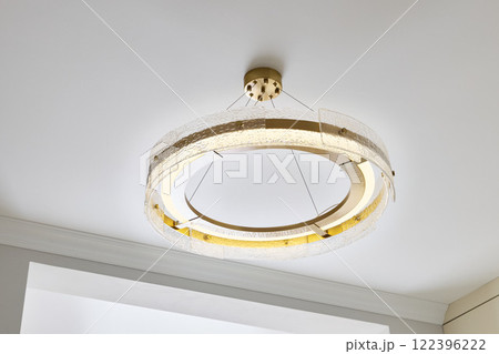 The stunning and modern LED Circular Chandelier boasts a unique and captivating design The stunning and modern LED Circular Chandelier boasts a unique and captivating design 122396222