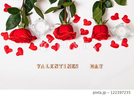 Bouquet of red roses, hearts and candles on white background. Valentine's day February 14. Place for your text. Bouquet of red roses, hearts and candles on white background. Valentine's day February 14. Place for your text. 122397235