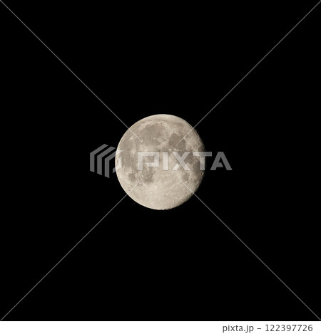 A breathtaking and stunning full moon gracefully illuminates the dark night sky above 122397726